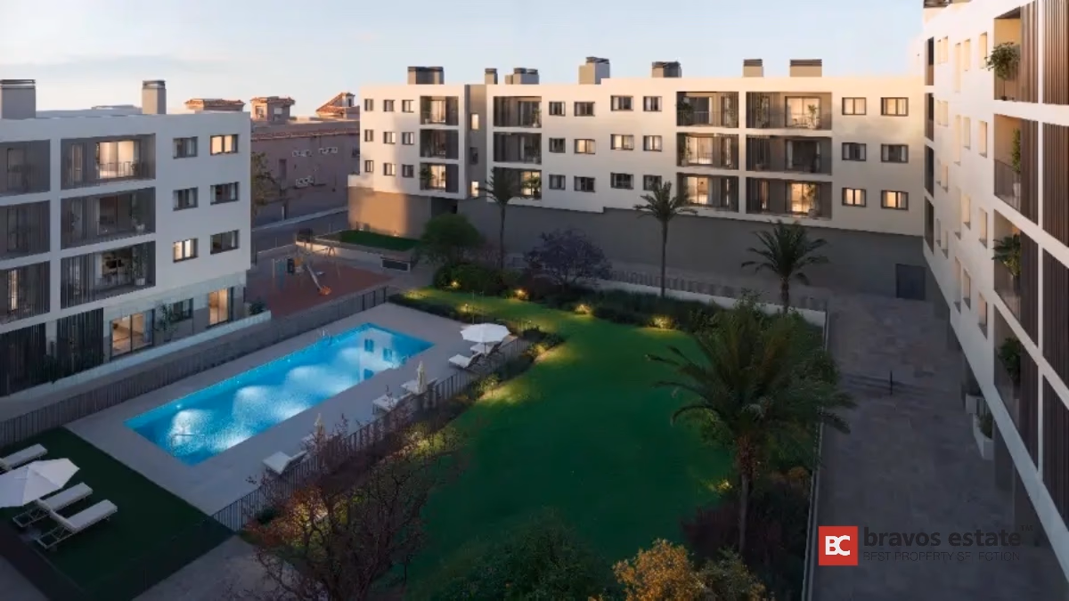 Modern apartment complex courtyard with pool and gardens in Alicante
