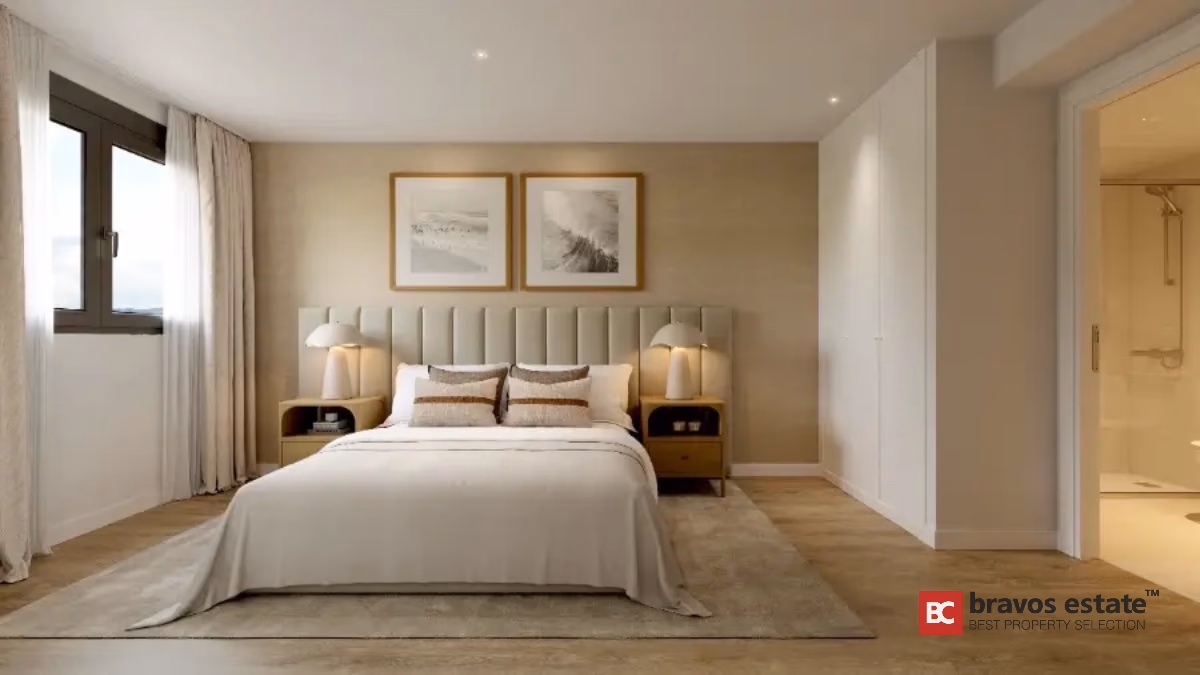 Modern bedroom interior with upholstered headboard in new Alicante apartment