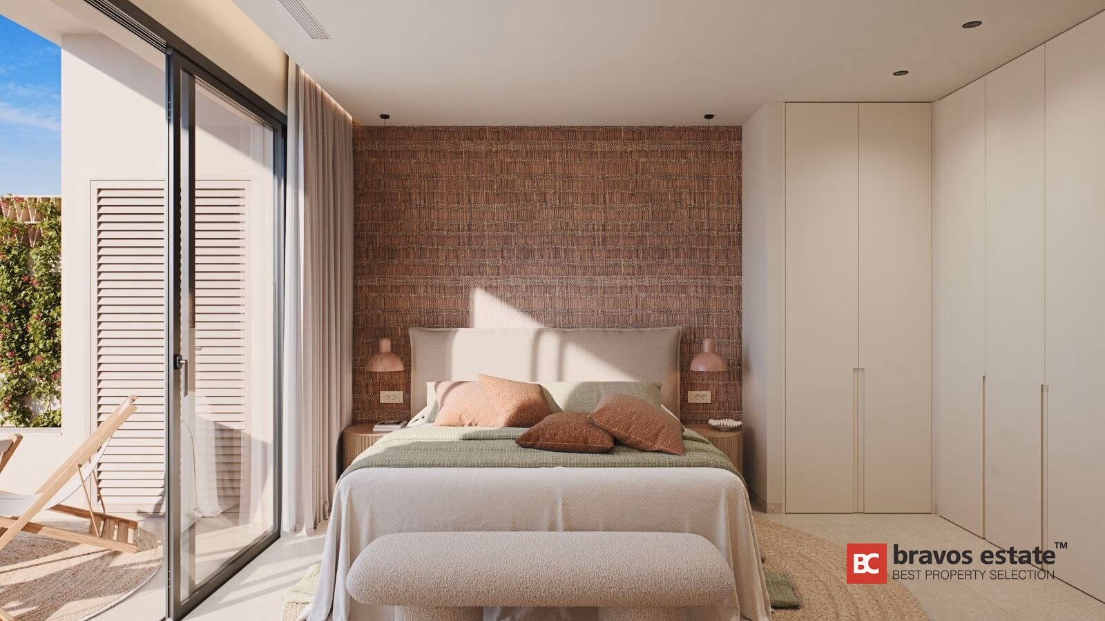 Bedroom with rattan-textured headboard wall, fitted wardrobes, and sliding doors opening to terrace with deck chair