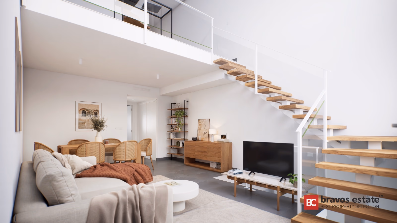 Double-height living space with wooden floating staircase and cane dining chairs in Gran Alacant townhouse