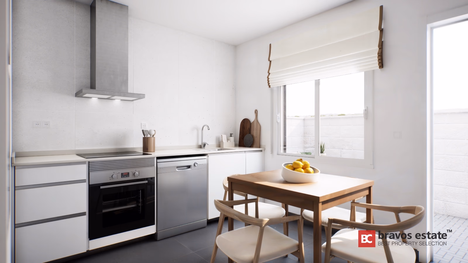 White kitchen with concrete countertops, wood dining table and stainless steel appliances in Gran Alacant