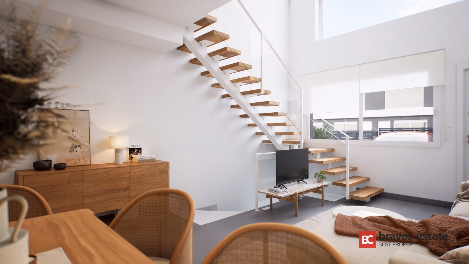 Open plan living room with floating wooden staircase and white railings in Gran Alacant townhouse