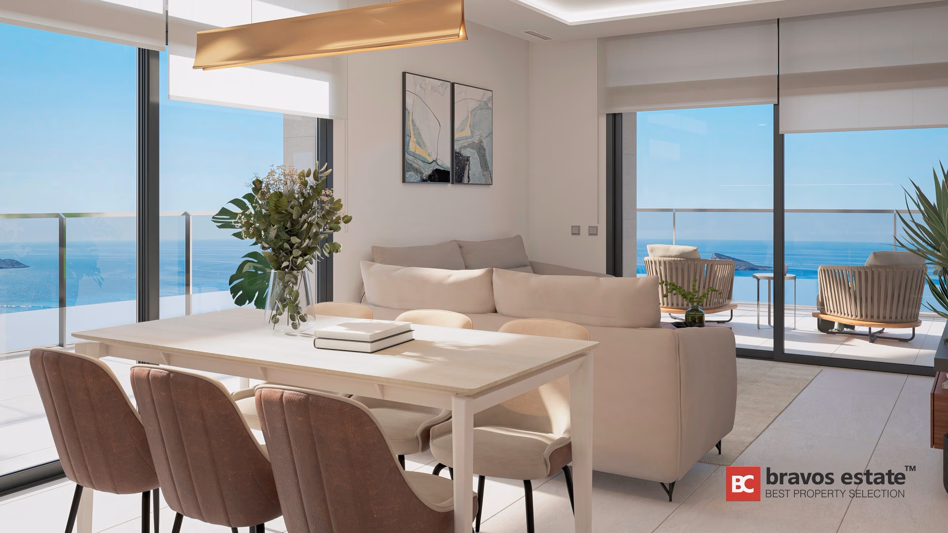 CGI render of TM Tower living-dining area with gold pendant light, cream sofa, and panoramic sea views through floor-to-ceiling glazing