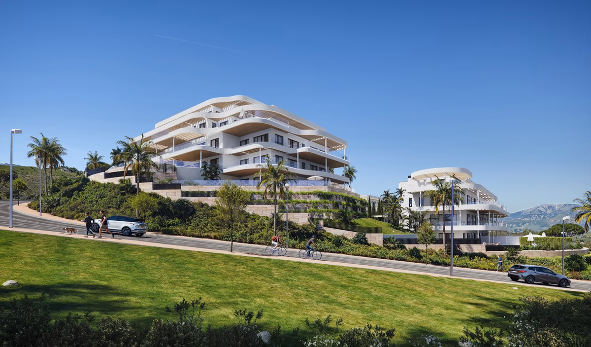 Curved white facades of 360º By Cordia from the gardens