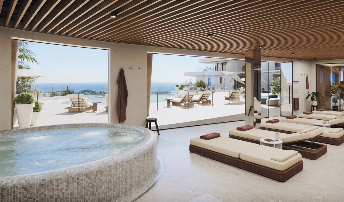 Heated indoor spa pool with jacuzzi and loungers