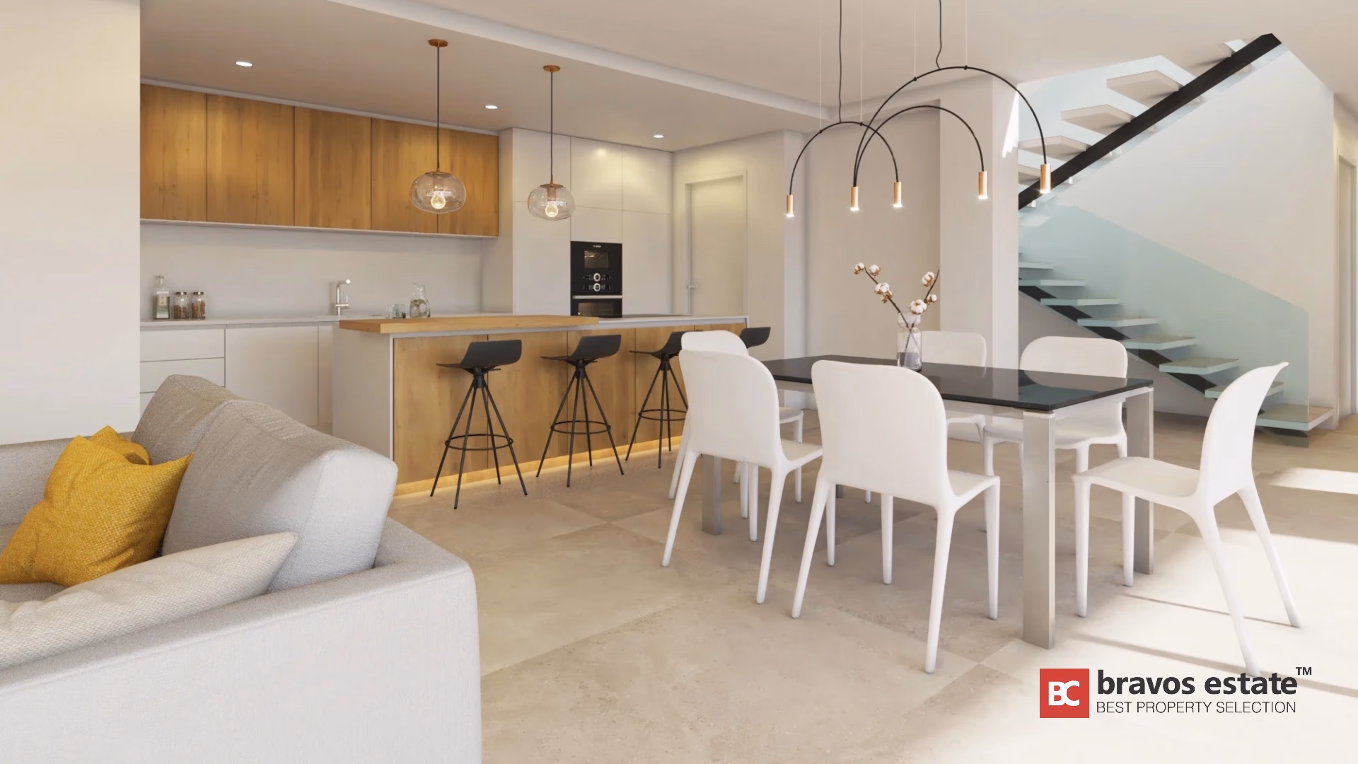 Open keuken met centraal eiland, eetkamer en zwevende trap