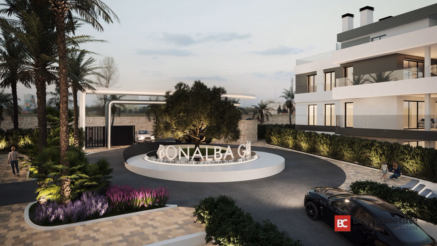 CGI render of the gated entrance roundabout at Bonalba Green Villas, featuring illuminated signage, palm trees, landscaped planting, and a modern white villa facade at dusk.