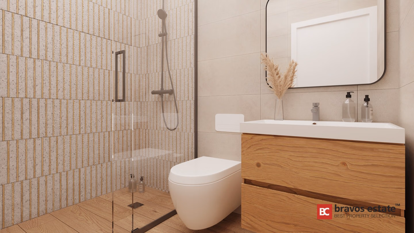 Render CGI del cuarto de baño de un apartamento de Bonalba Green con ducha de obra acristalada, azulejos decorativos, inodoro suspendido y mueble de baño flotante en roble con gran espejo.