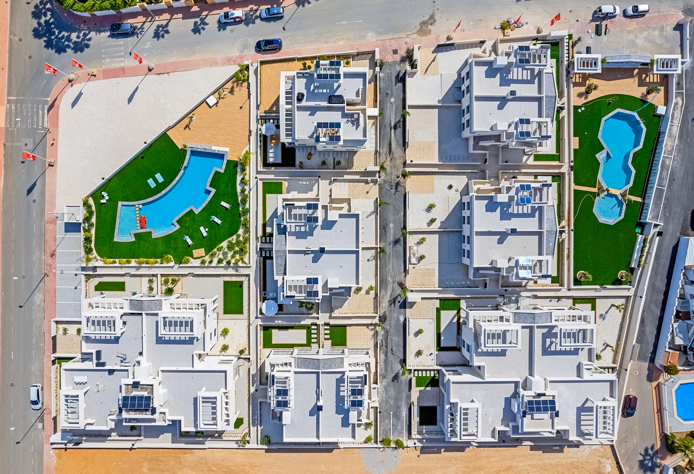 Aerial view of the apartment blocks, semi-detached villas and both communal pools