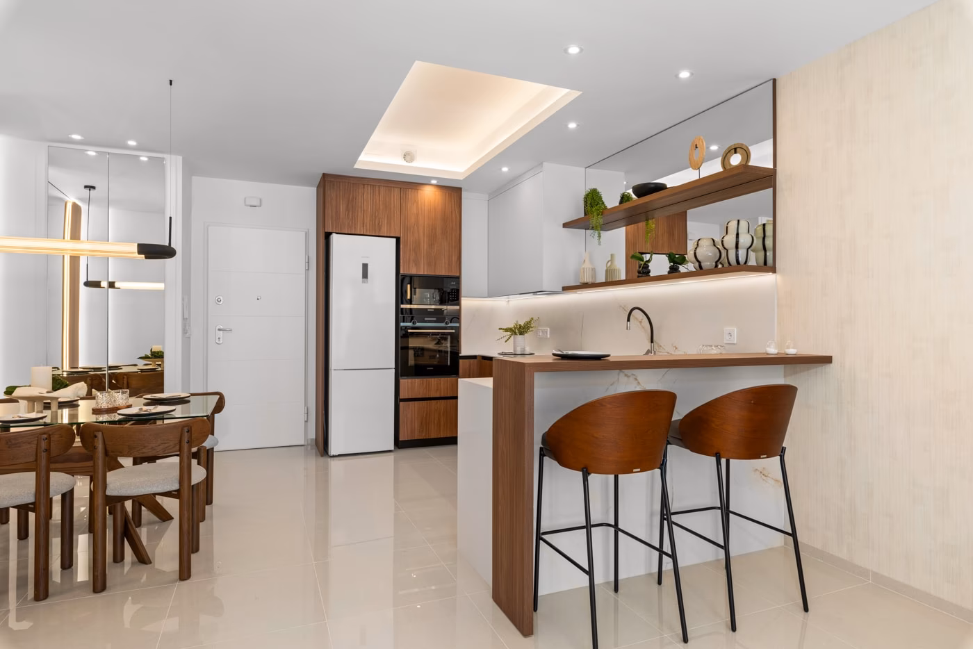 Open kitchen with breakfast bar and bar stools