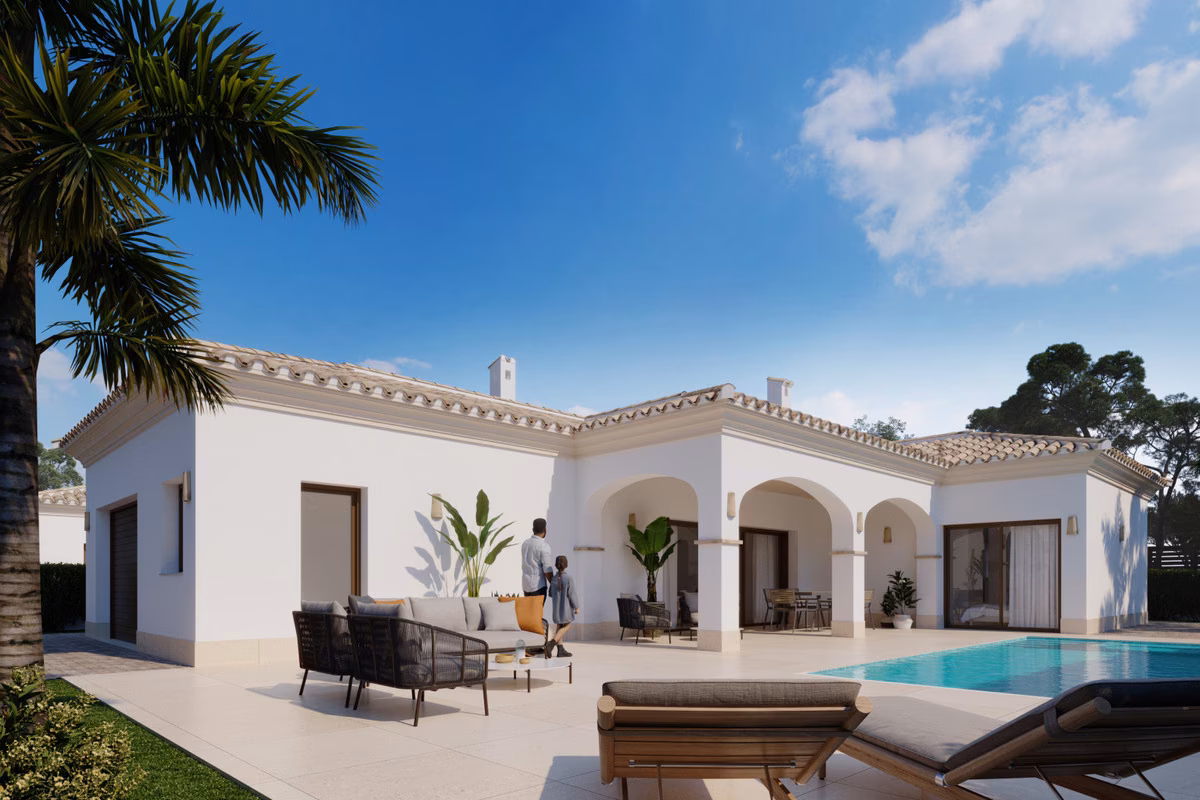 Villa seen from the garden, with the pool and an outdoor lounge set