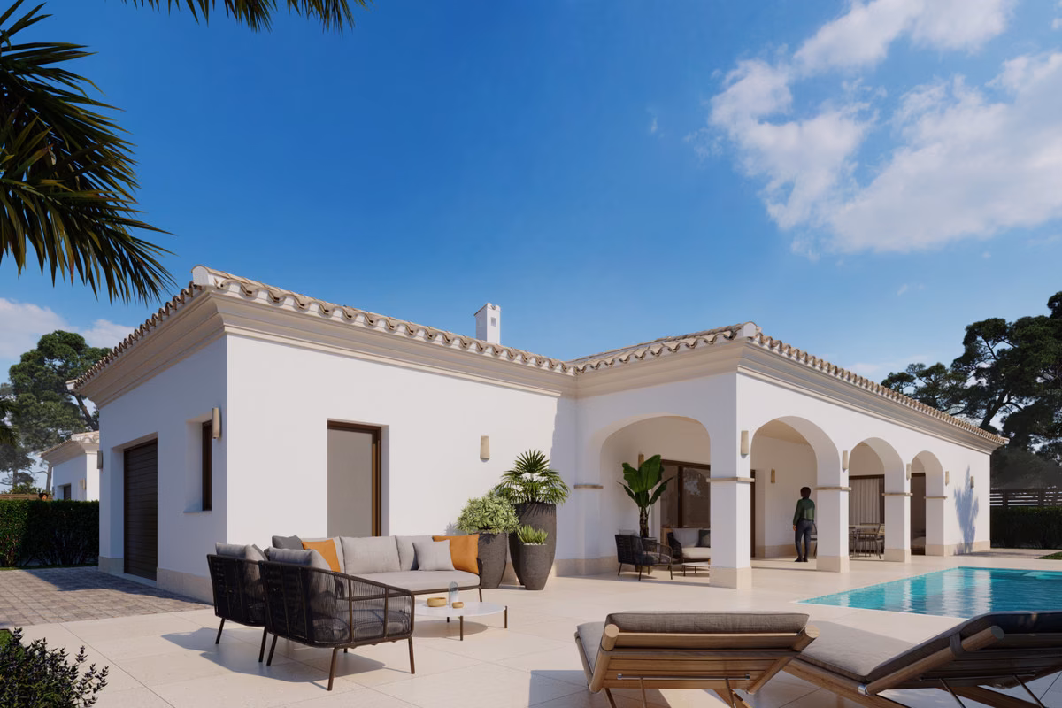 Terrace with outdoor sofas and loungers beside the villa