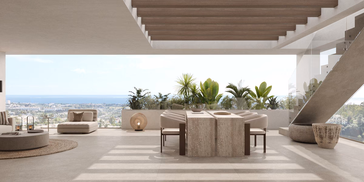 Covered rooftop terrace with dining table and panoramic view to the sea