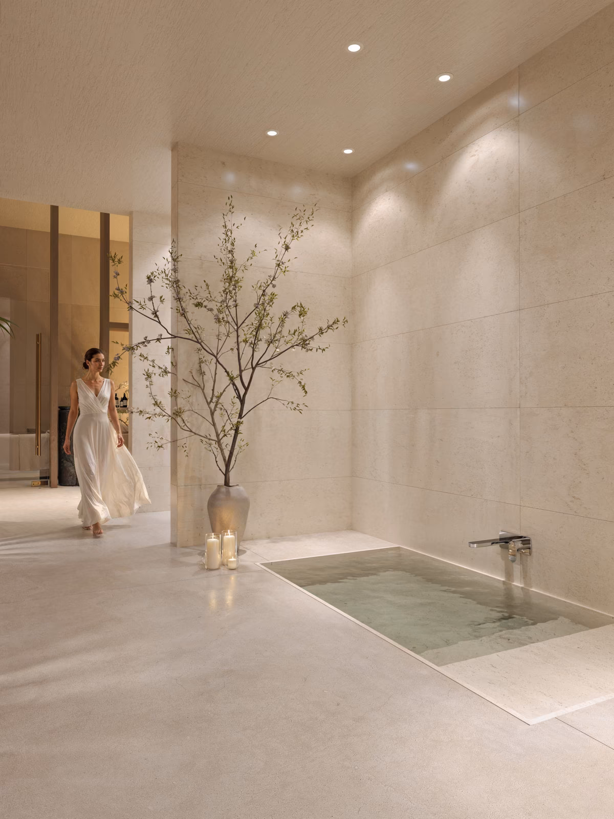 Spa plunge pool in a travertine-lined room