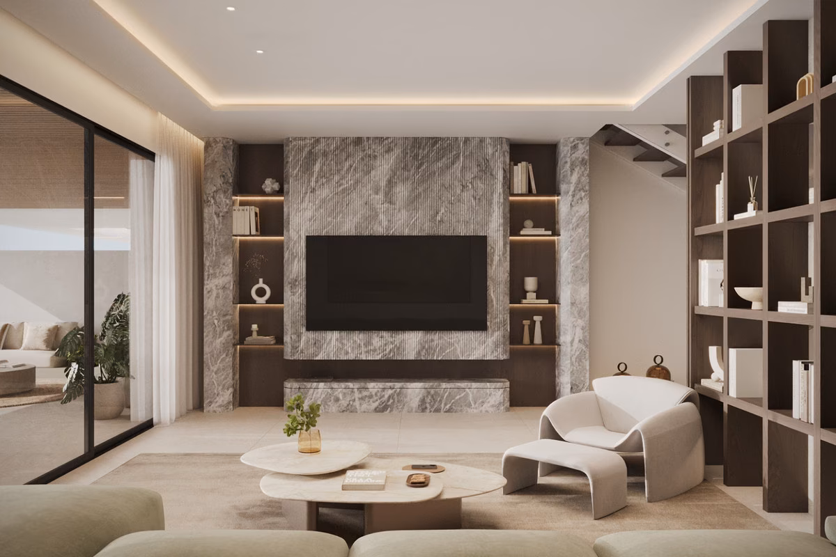 Living room with marble TV wall and glass doors to the terrace
