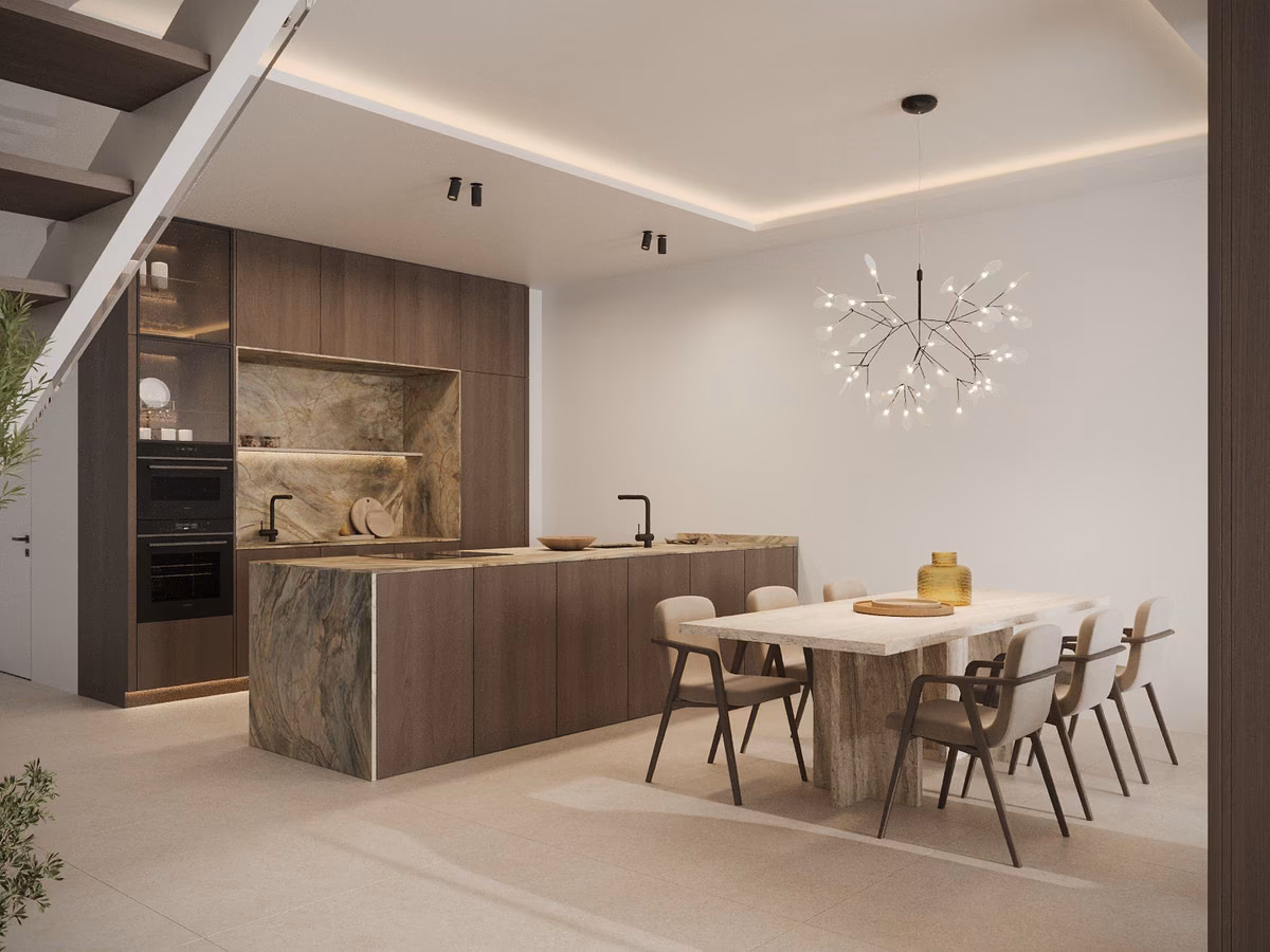 Duplex kitchen with marble island, dining table and staircase