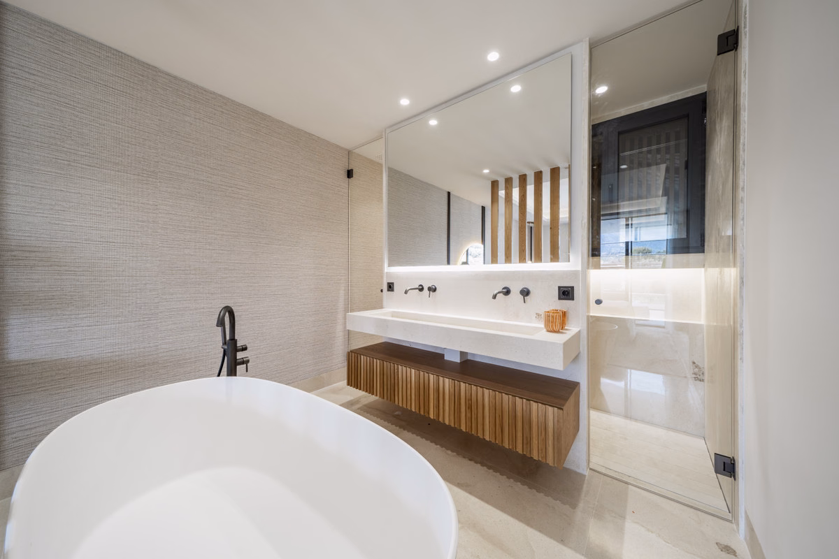 Bathroom with freestanding bath and twin basins in an Aloha Forest apartment