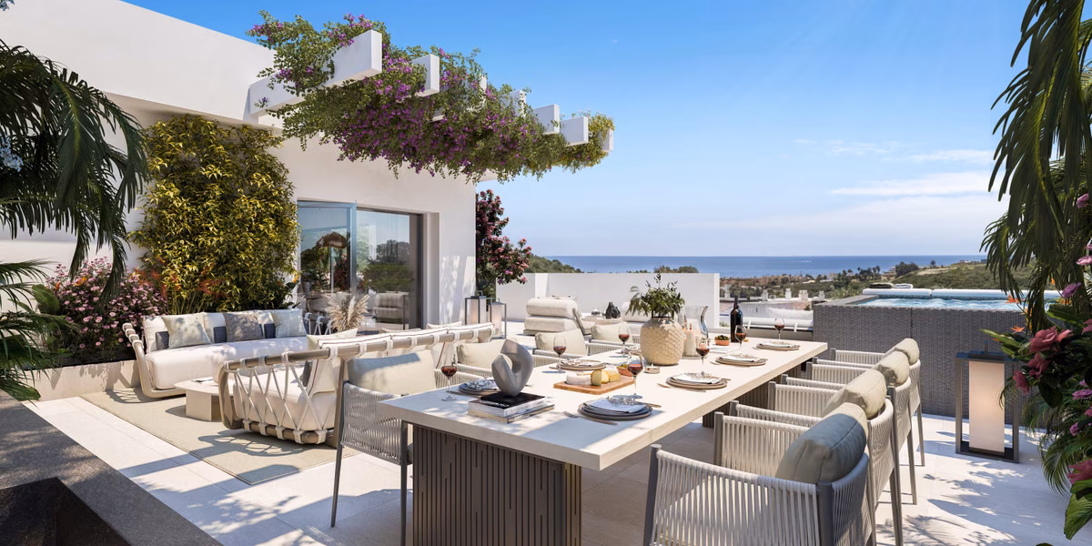 Roof terrace with an outdoor dining table and sea view
