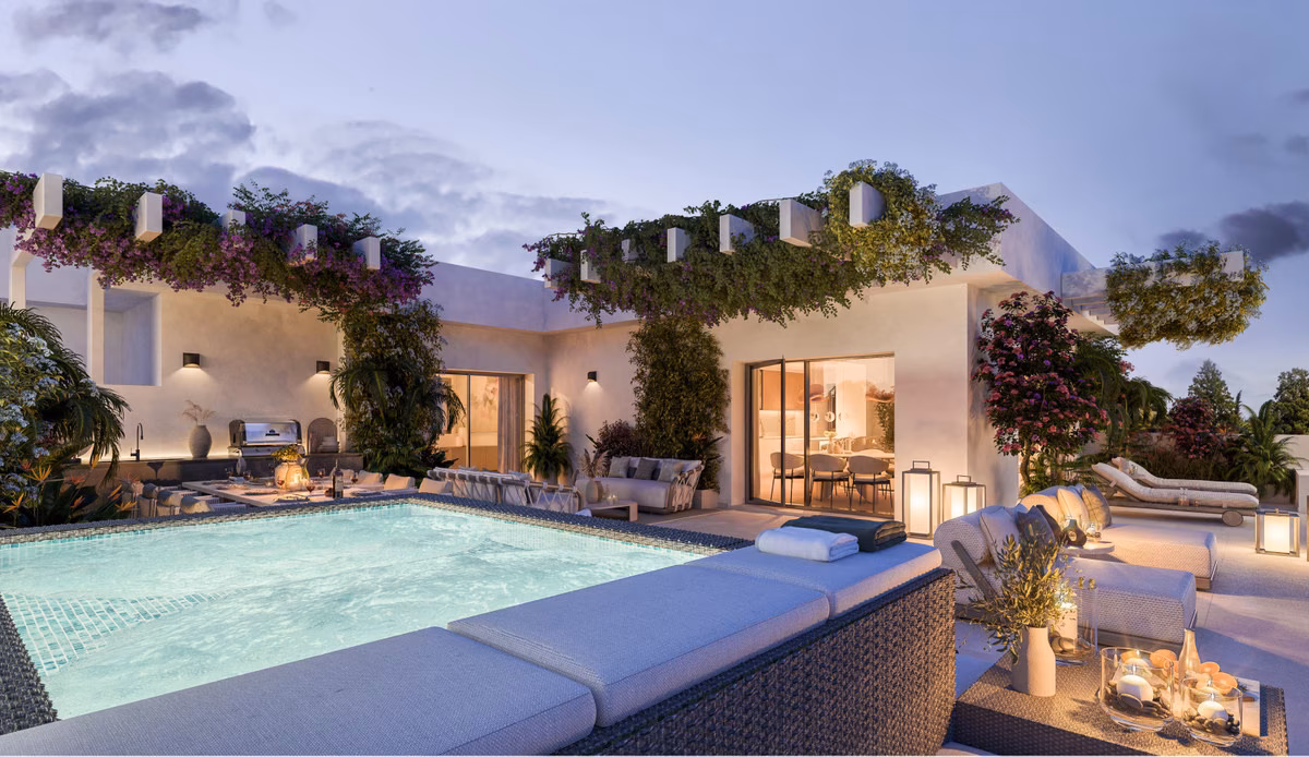 Terrace with a small plunge pool under a pergola at dusk