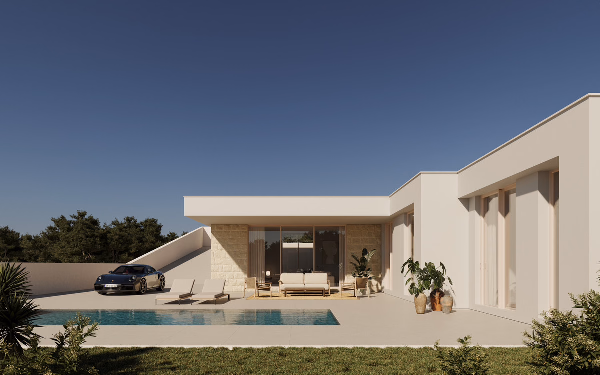 The villa and pool at dusk
