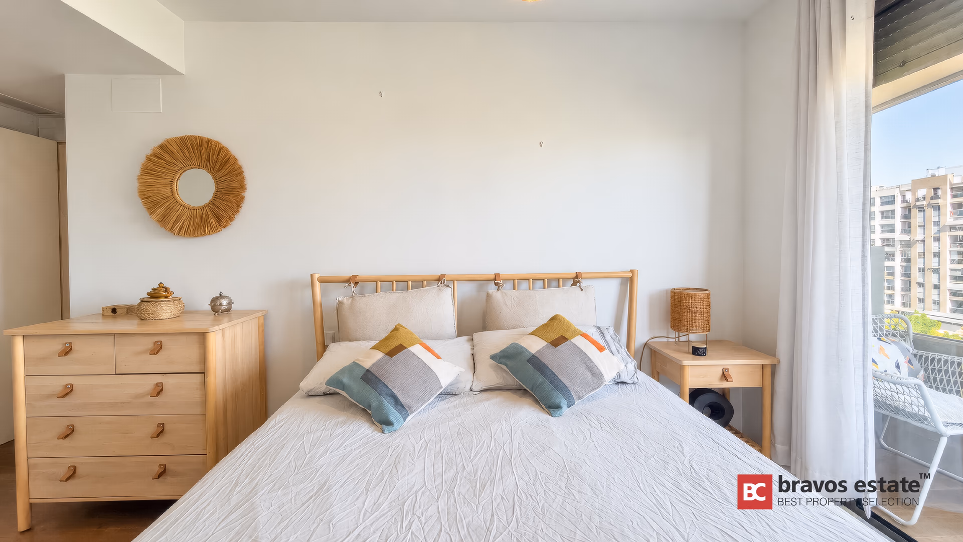 Main bedroom with a double bed and a window looking over PAU 5