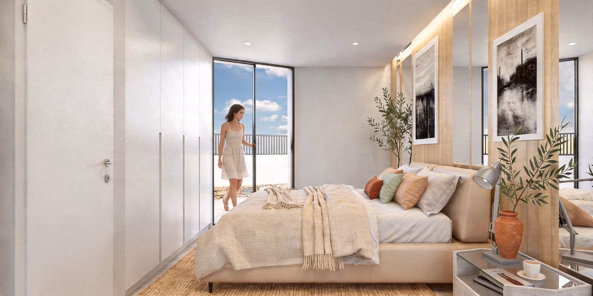Chambre avec placard intégré et porte vitrée sur la terrasse