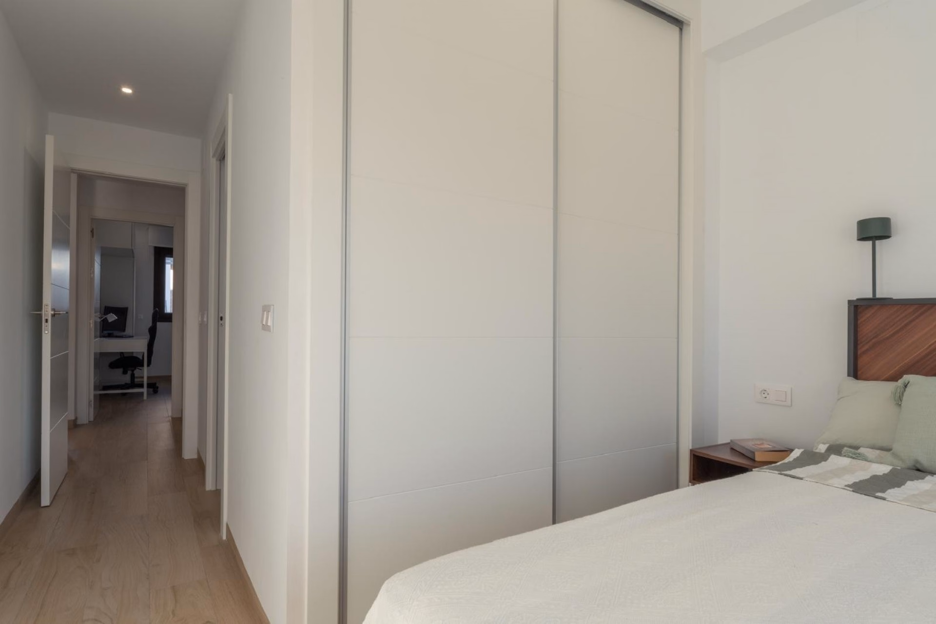 Bedroom with fitted wardrobe and the inner hall