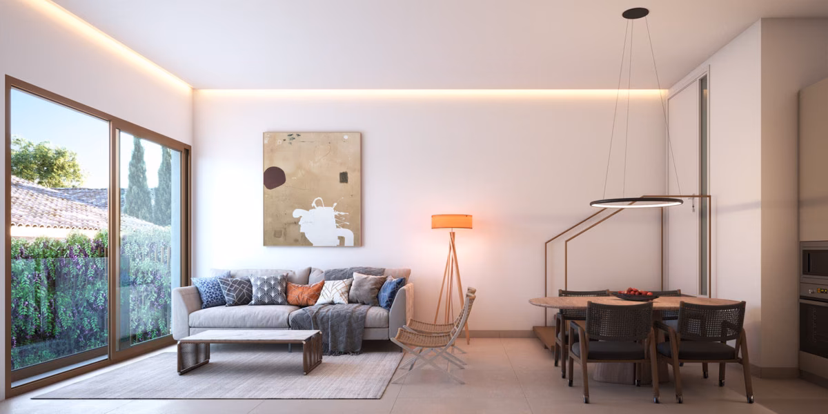 Living room with sofa and glass doors onto a green terrace, Bastion Sea Views