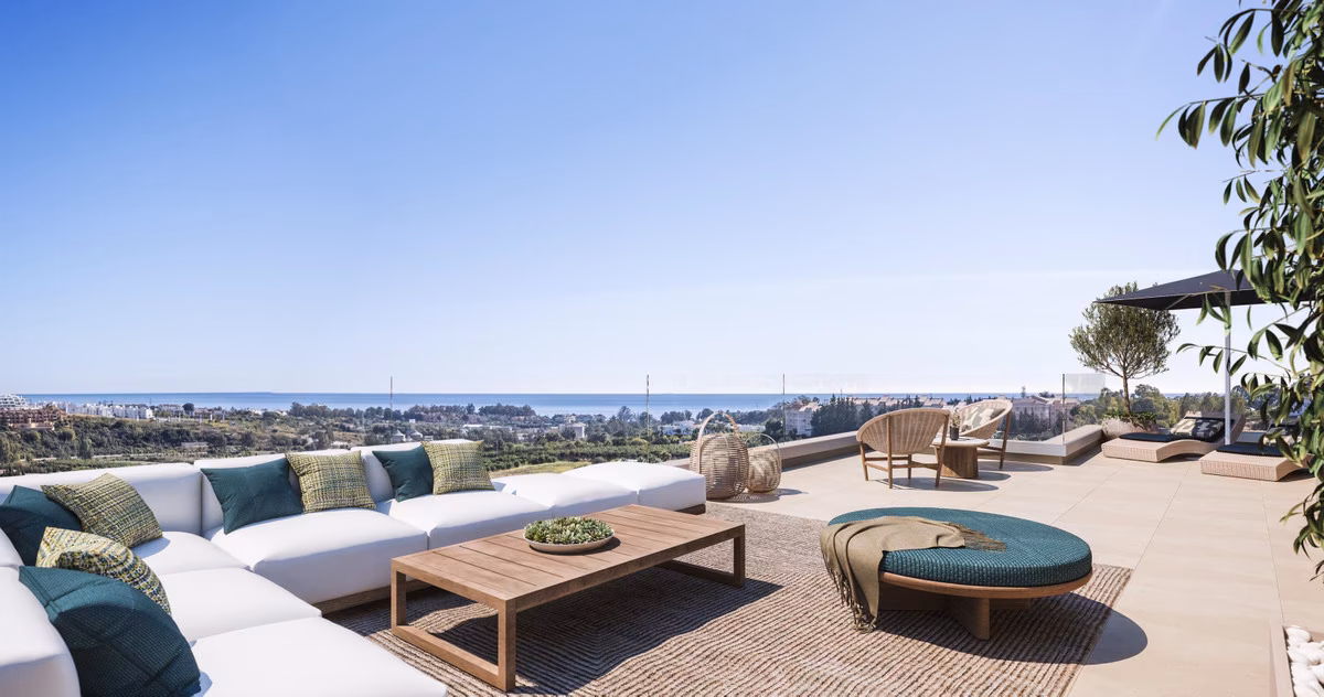 Rooftop solarium lounge with sofas and a view to the sea at Capri, Estepona