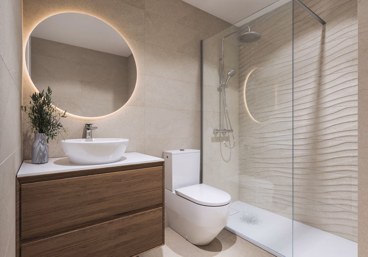 Bathroom with round mirror, vessel basin and walk-in shower at Capri
