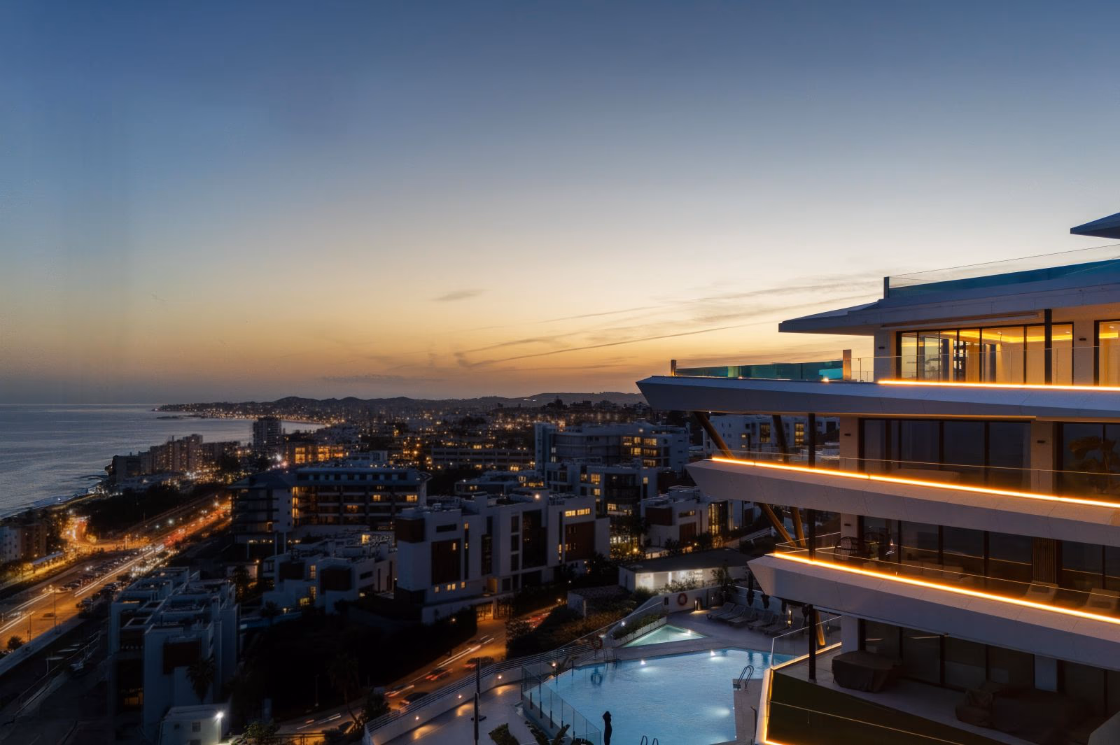Aerial dusk view of CARAT above the coast, El Higuerón, Fuengirola