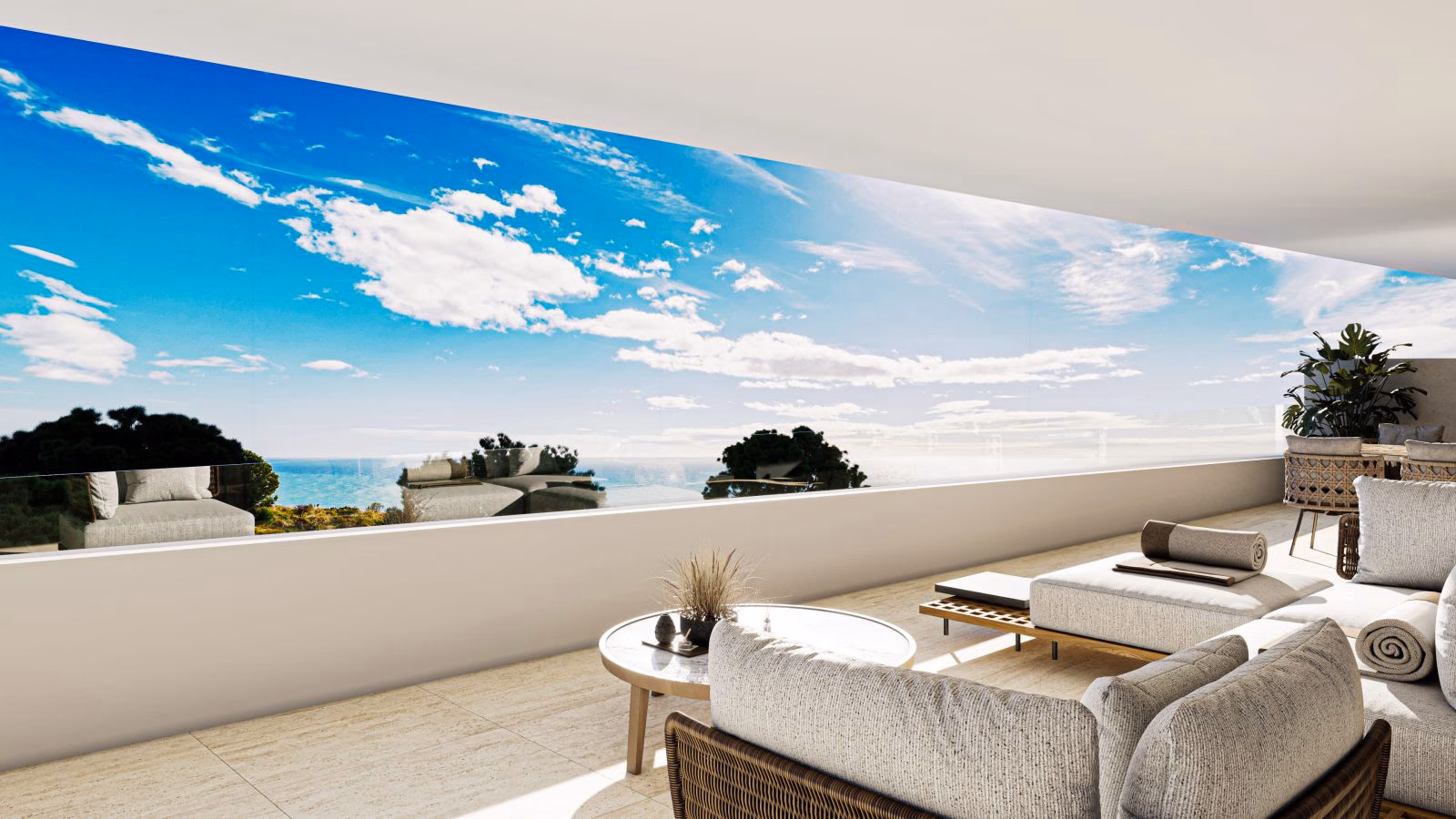 Espace repas en terrasse avec vue sur la mer et le ciel