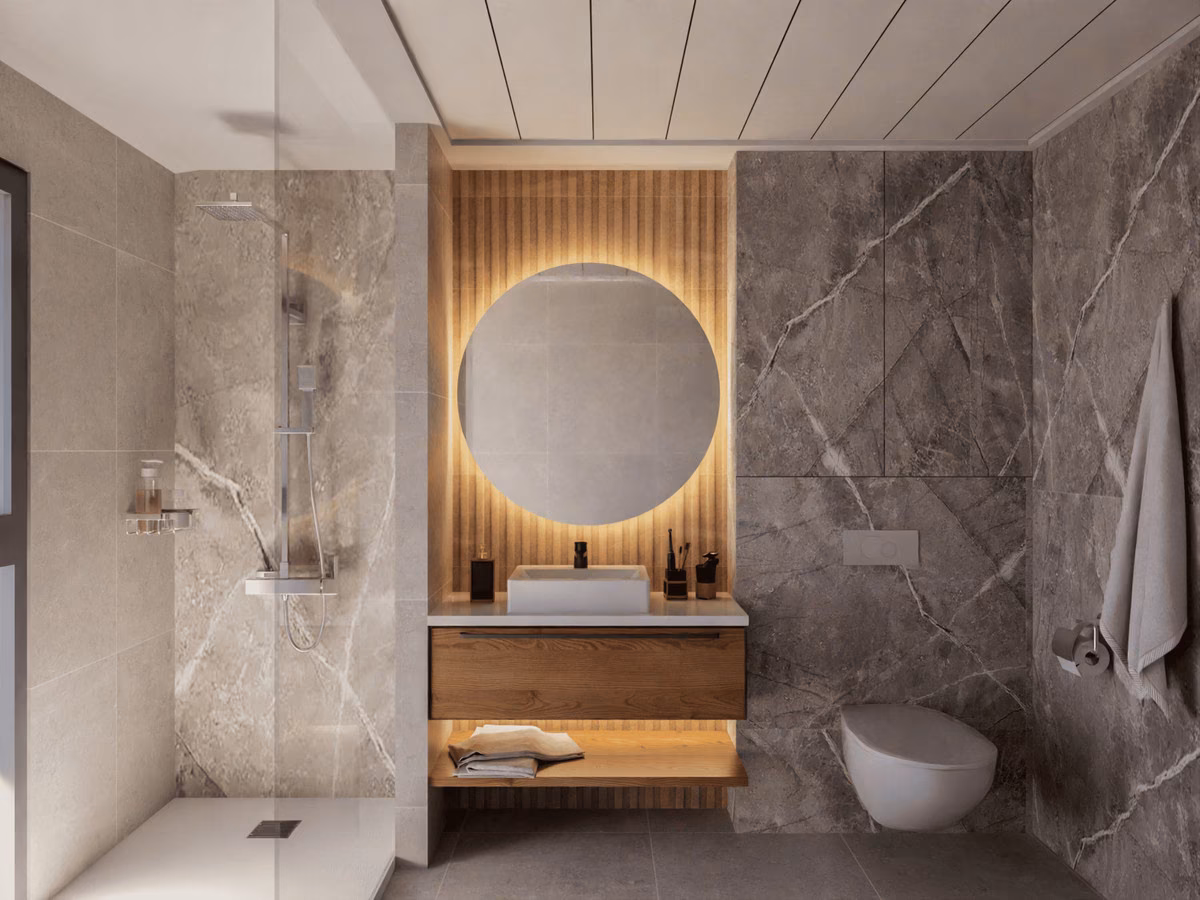 Bathroom with round mirror and walk-in shower