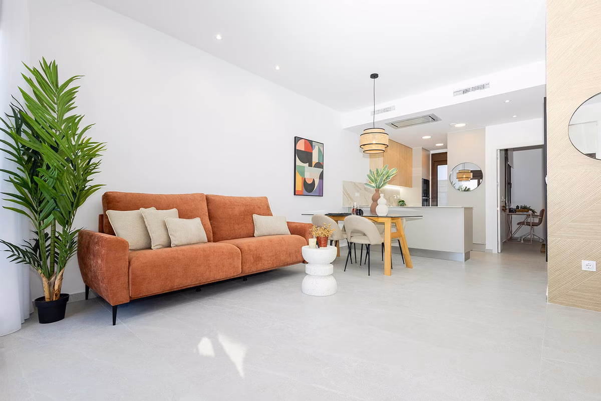 Open-plan living room with the dining area and kitchen beyond