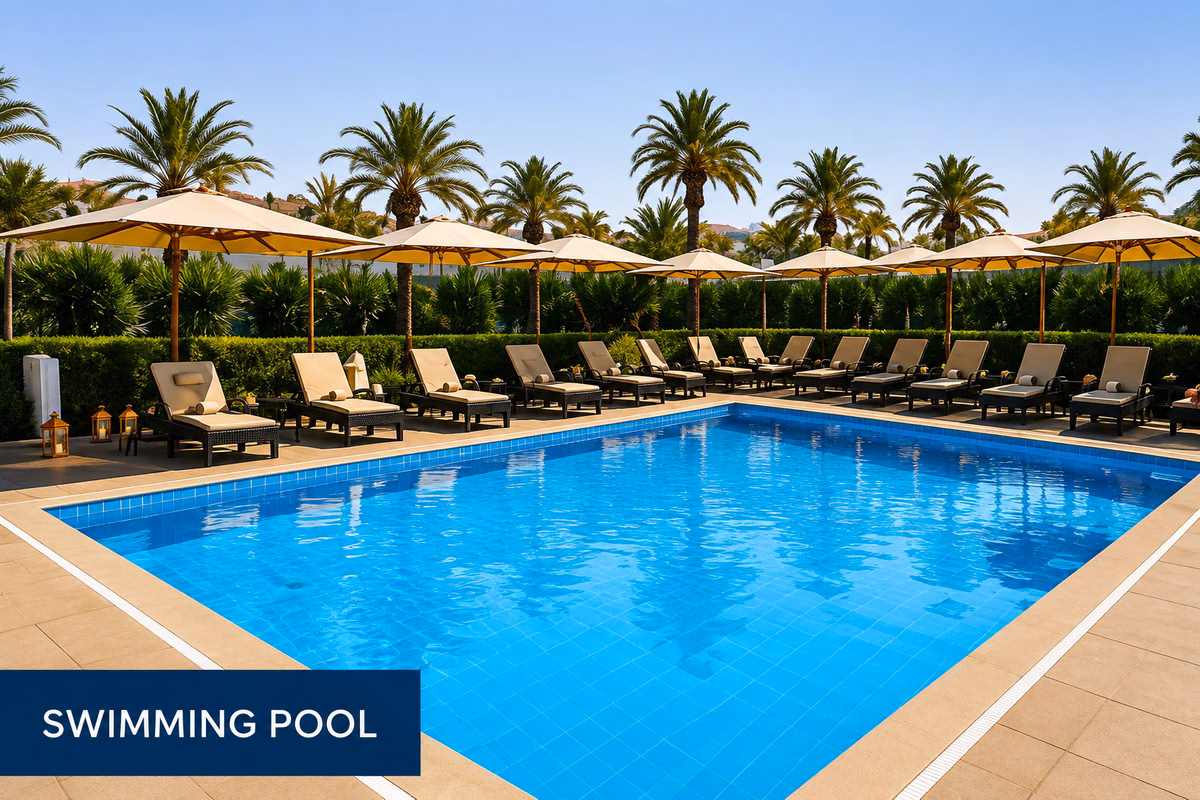 Swimming pool with sun loungers and parasols, Crystal Bay Suites Los Alcázares