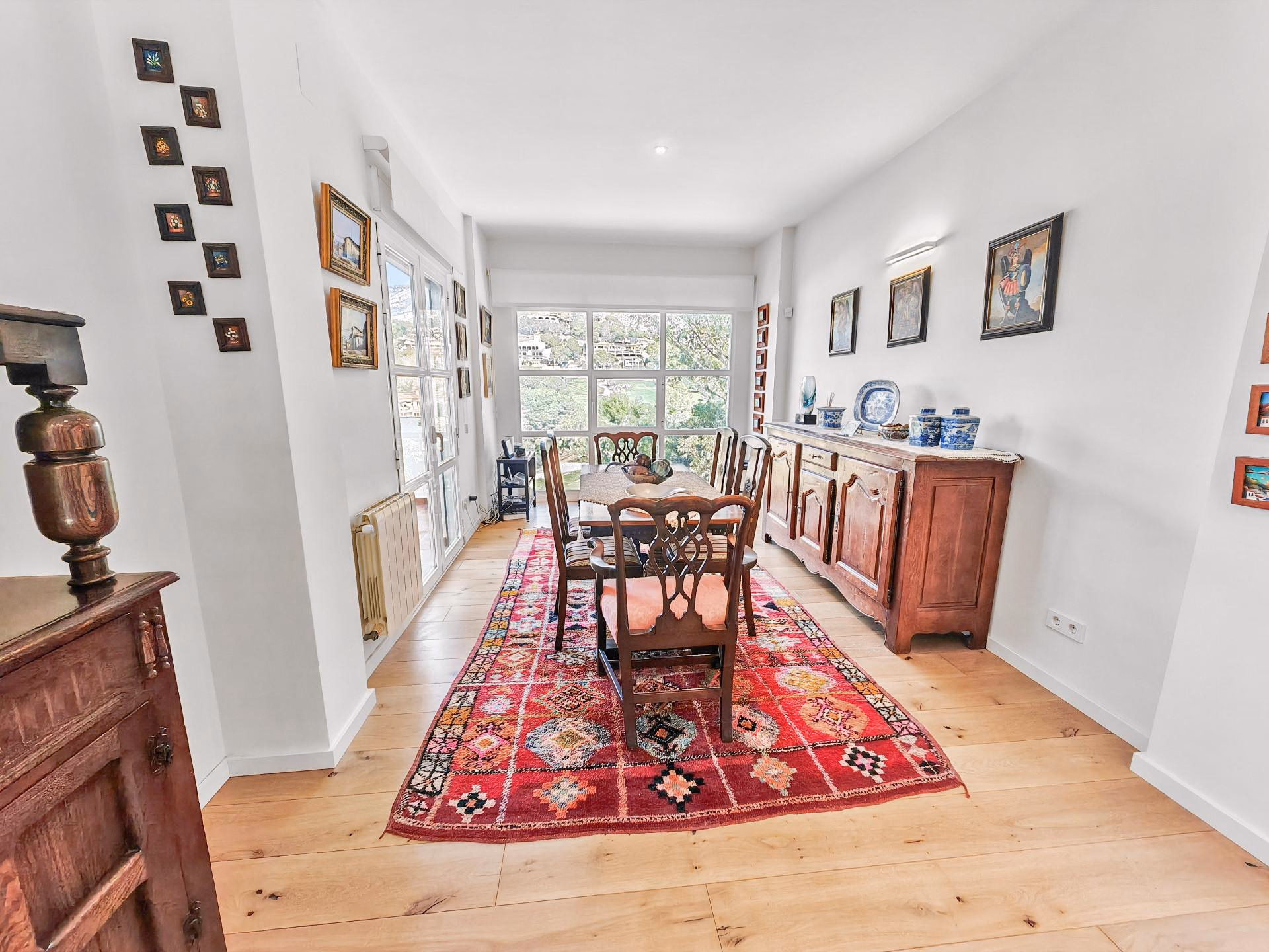 Dining room with a long wooden table and a sideboard