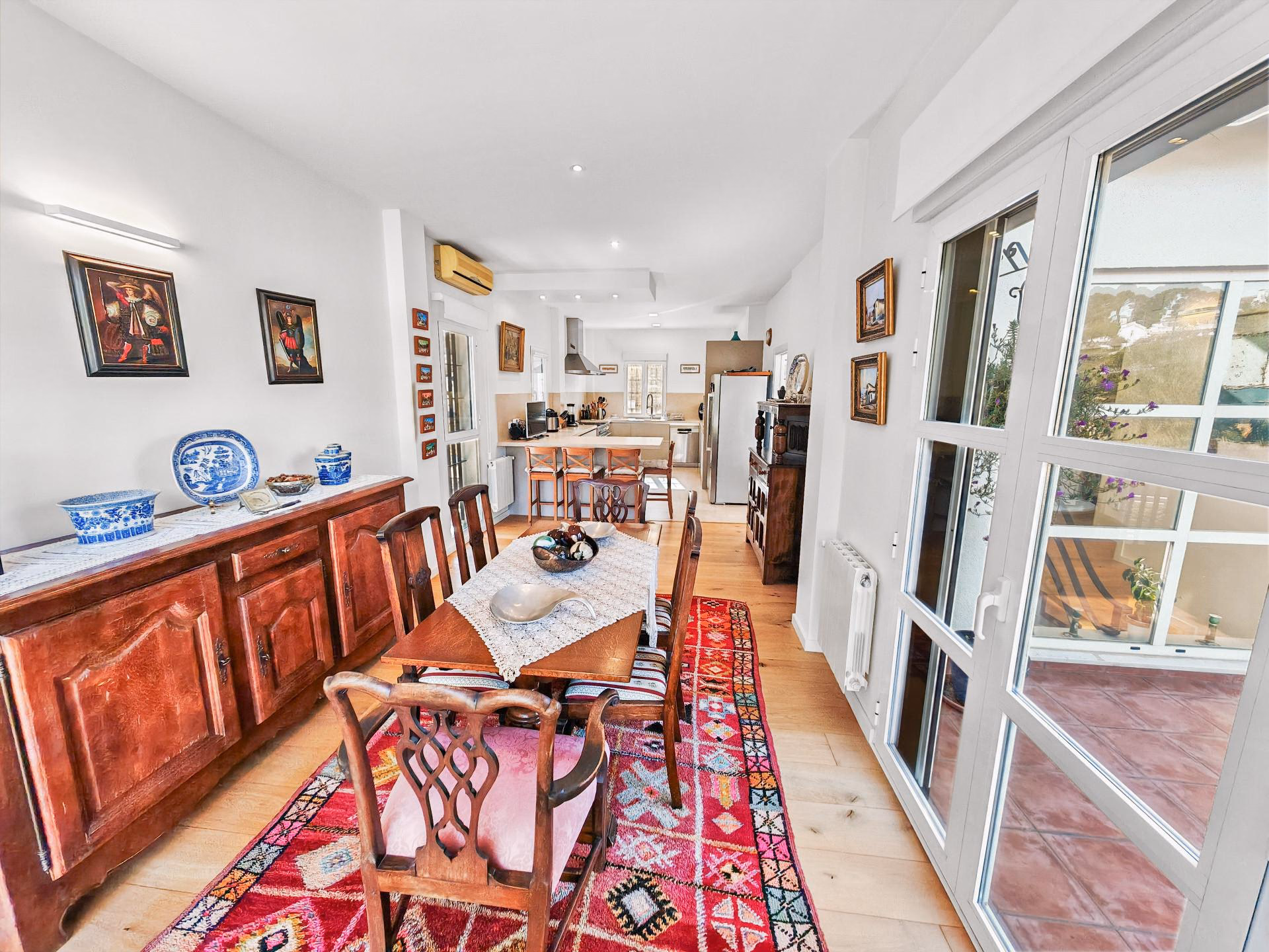 Dining area with garden views through glazed doors