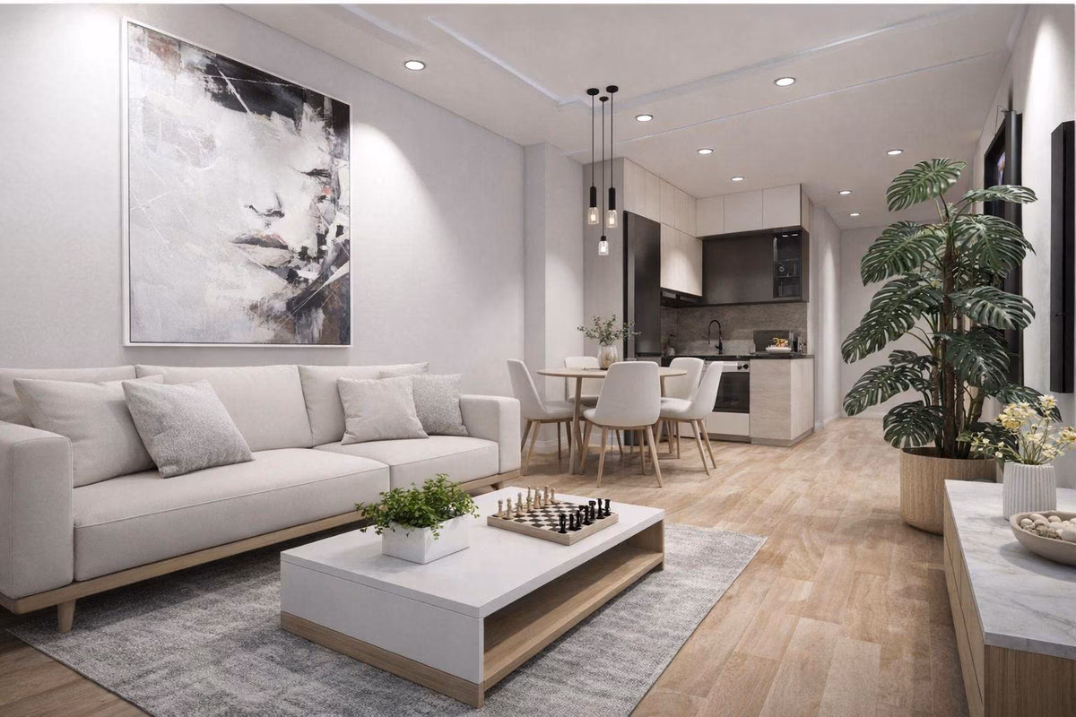 Wohnbereich mit Sofa und Esstisch neben der Küche
