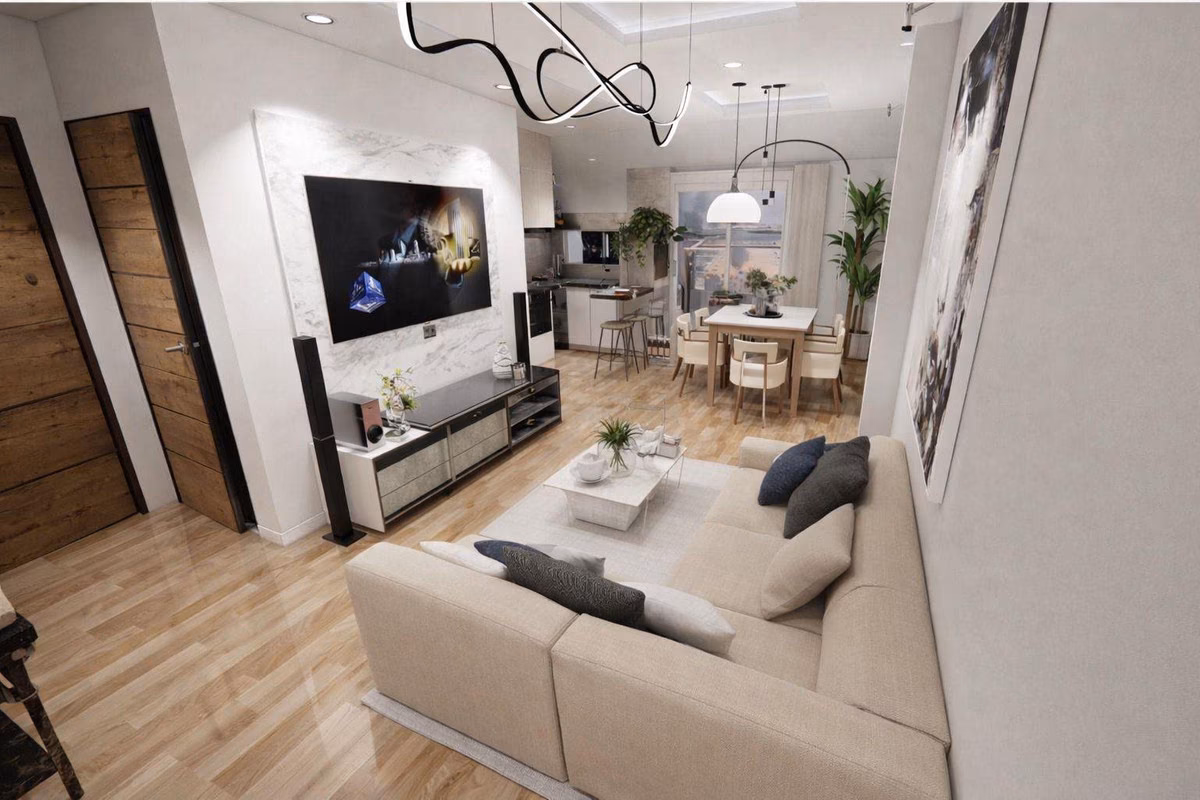 Wohnzimmer mit Ecksofa und TV-Wand