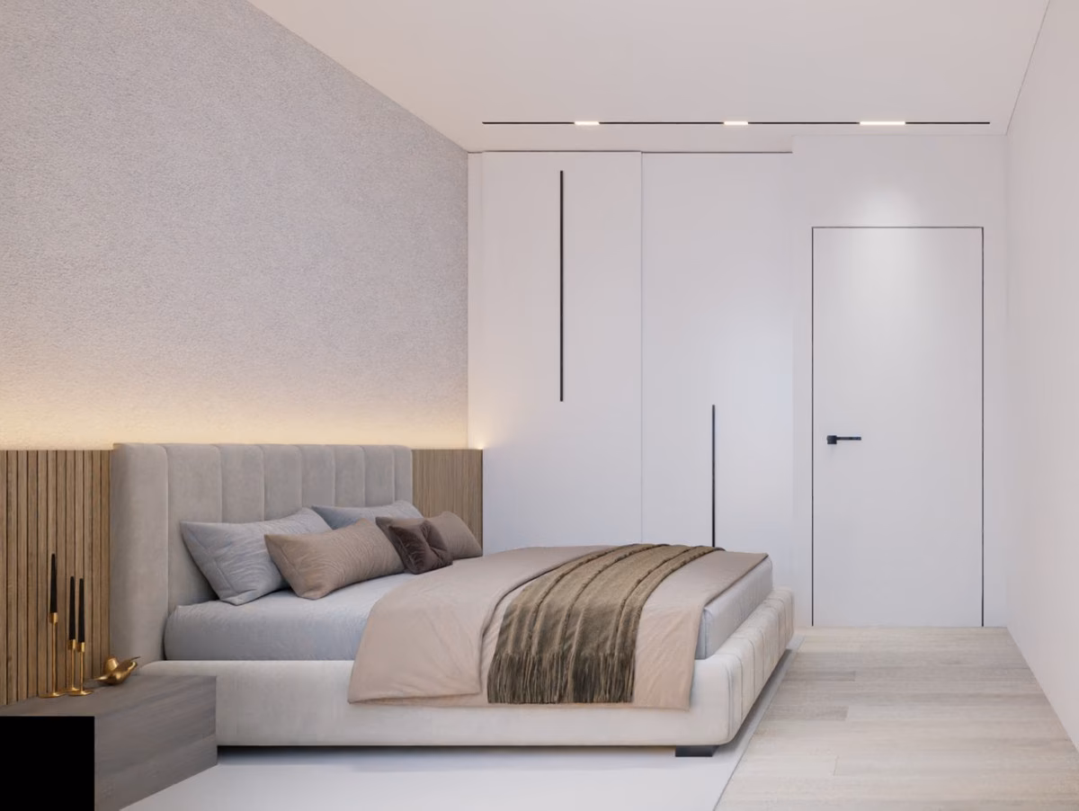 Slaapkamer met beige hoofdeinde en bedverlichting in een appartement van Edificio Soprano