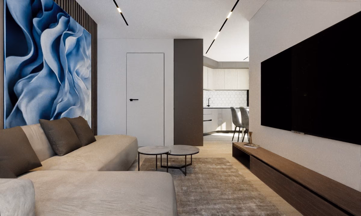 Woonkamer met blauw schilderij en gang naar de slaapkamers in een appartement van Edificio Soprano