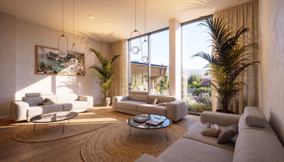 Wohnzimmer mit Sofas, Pflanzen und hohen Fenstern zur Terrasse