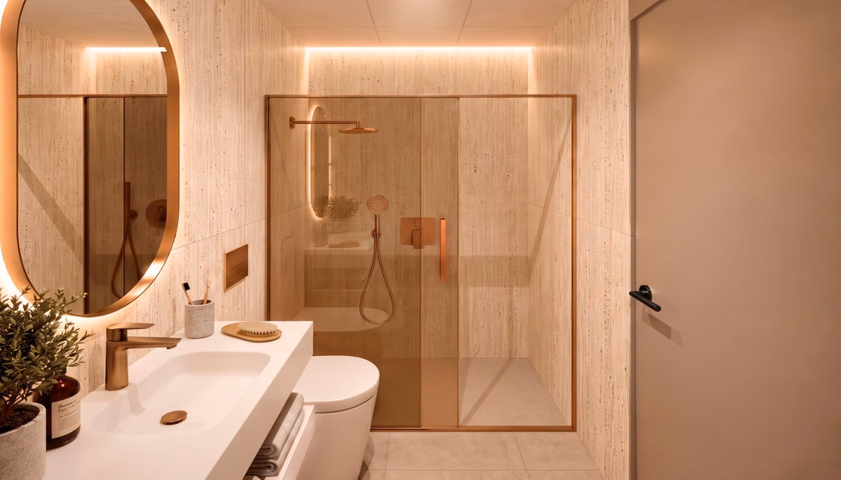 Badezimmer mit hinterleuchtetem ovalem Spiegel und Glasdusche