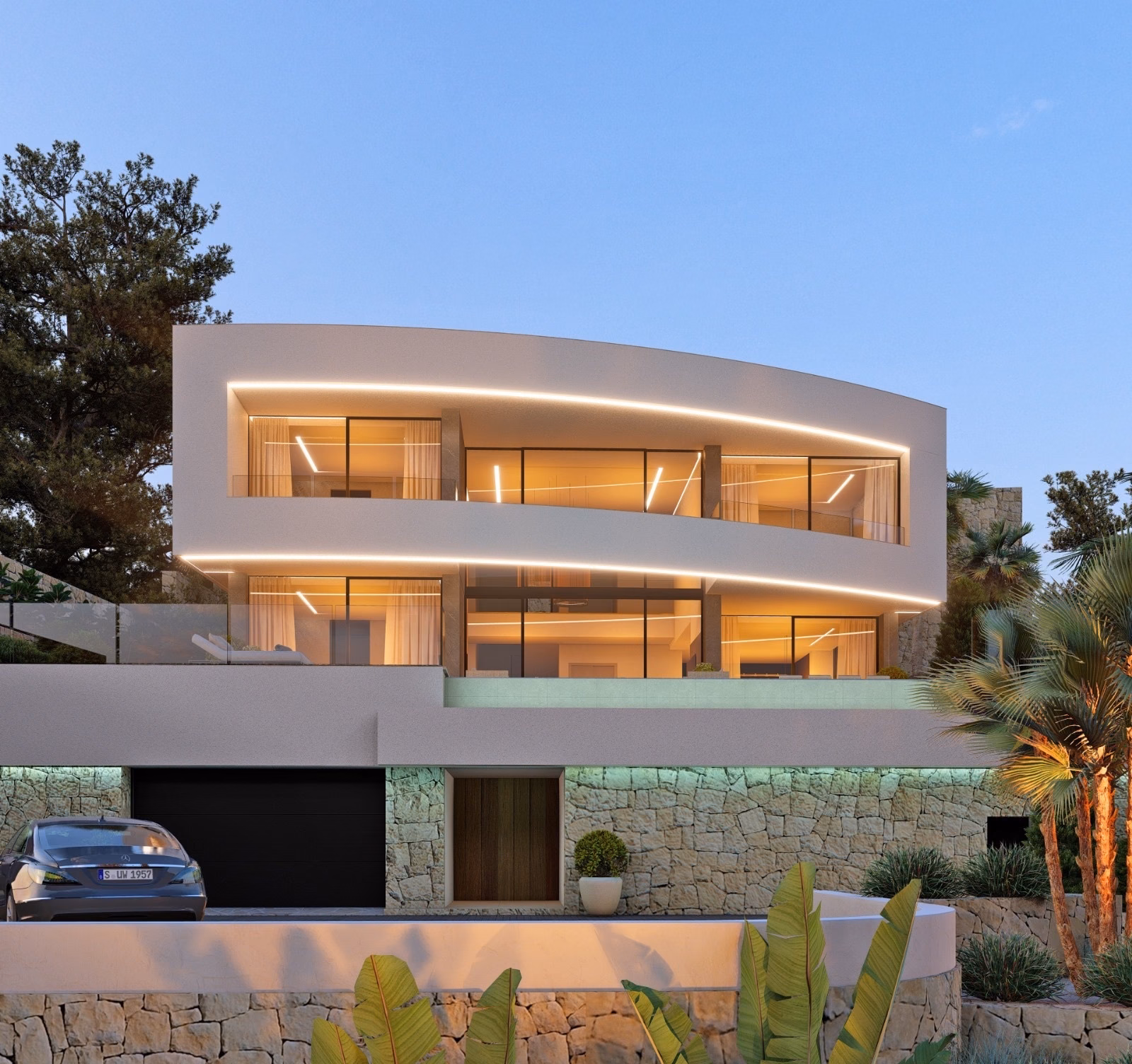 Empedrola Sup 2L at dusk: curved white façade with lit glazing above a stone base
