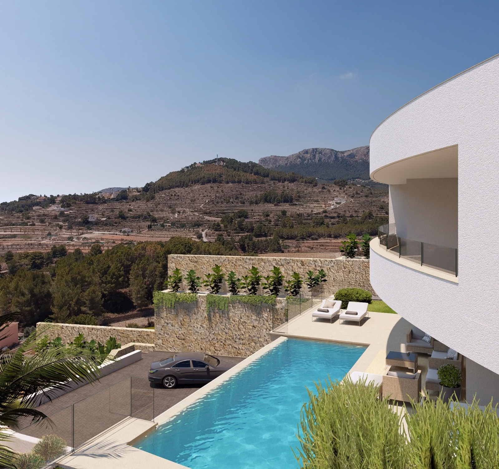 Pool and terrace beside the curved upper floor, with the hills behind