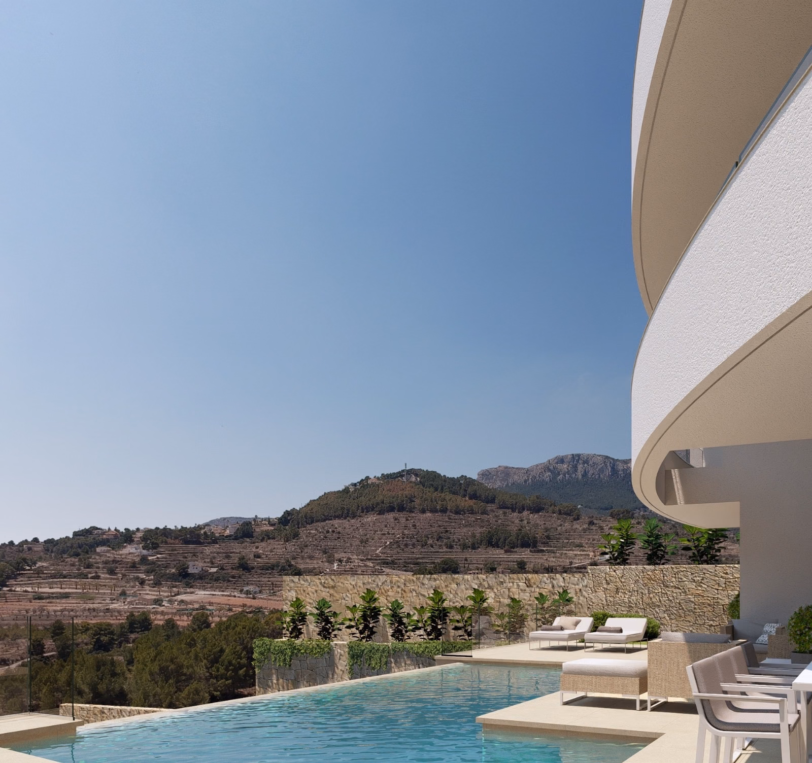 Pool with sun loungers and a view of the mountains