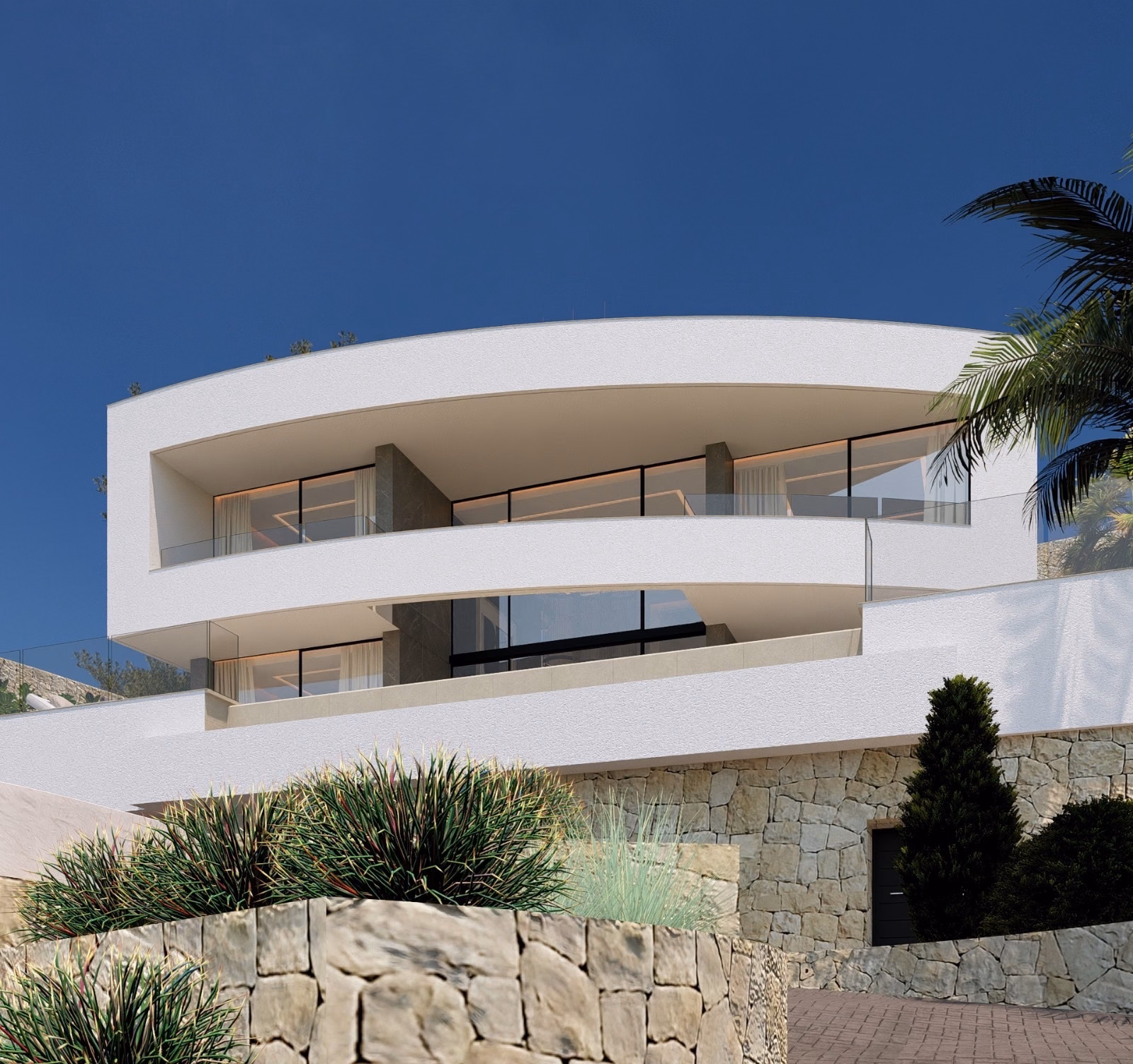 Villa seen from below, with a stone wall and palm trees