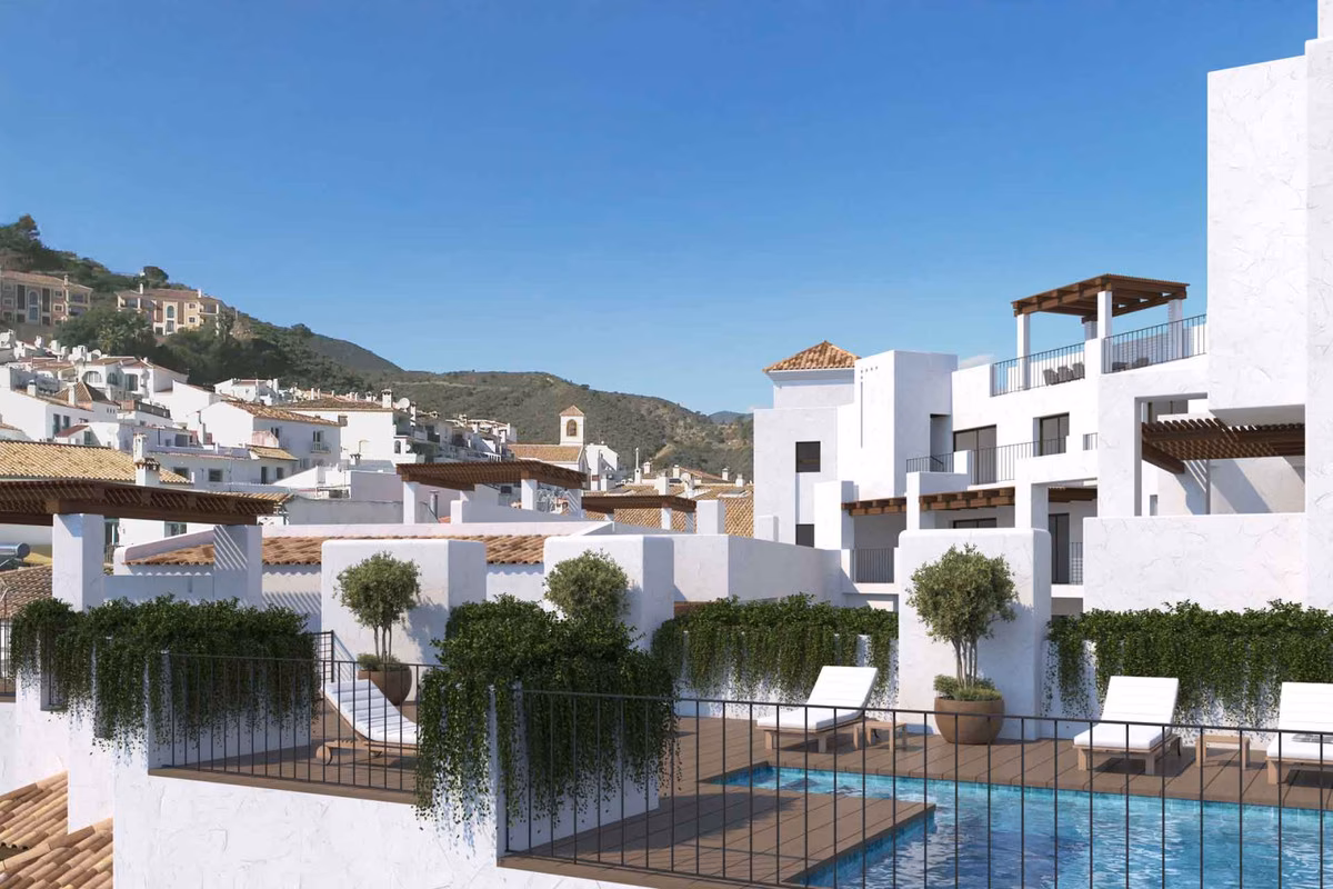 Rooftop pool terraces against the village skyline