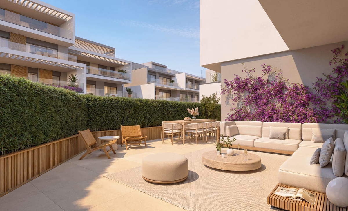 Private garden terrace with seating in a ground-floor Isla Bela apartment