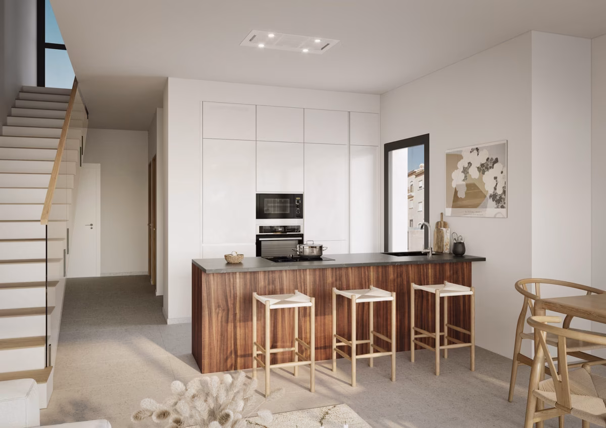Kitchen with island and bar stools beside the staircase at La Gomera Star